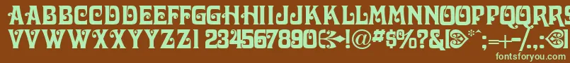 フォントVictorianadisplaycapsssk – 緑色の文字が茶色の背景にあります。