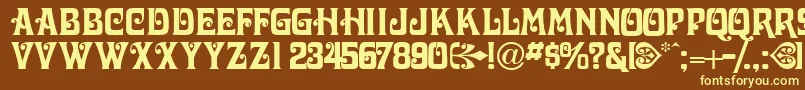 Victorianadisplaycapsssk-fontti – keltaiset fontit ruskealla taustalla