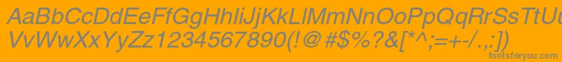 HelioscItalic-fontti – harmaat kirjasimet oranssilla taustalla