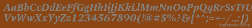OctavaBoldItalic-fontti – harmaat kirjasimet ruskealla taustalla