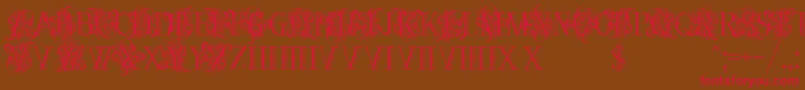 Czcionka Ornamentalversals – czerwone czcionki na brązowym tle