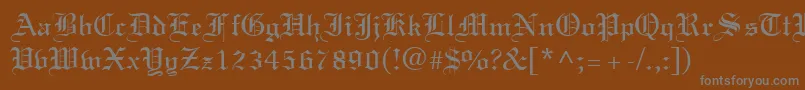 Saiba mais sobre a fonte TexturRegular Fonte TexturRegular – fontes cinzas em um fundo marrom