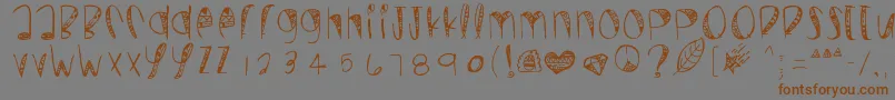 フォントWildcrazy – 茶色の文字が灰色の背景にあります。