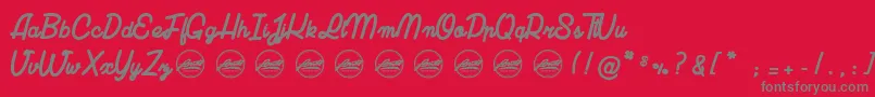 LuciaPersonalUseOnly-fontti – harmaat kirjasimet punaisella taustalla