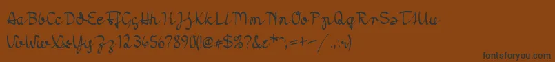 フォントMoradoNib – 黒い文字が茶色の背景にあります