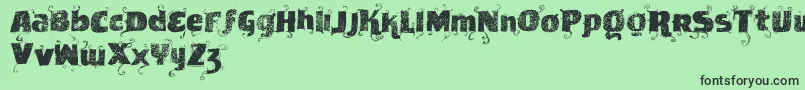 Vtksnewslabel-Schriftart – Schwarze Schriften auf grünem Hintergrund