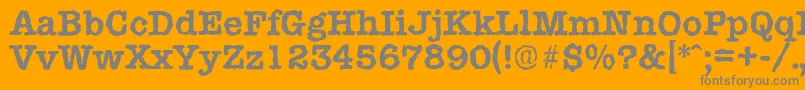 TypewriterrandomBold-Schriftart – Graue Schriften auf orangefarbenem Hintergrund