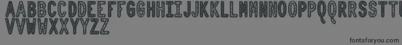 フォントOrnadDentroTfb – 黒い文字の灰色の背景