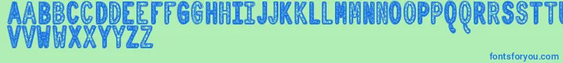 フォントOrnadDentroTfb – 青い文字は緑の背景です。