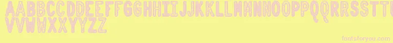 OrnadDentroTfb-fontti – vaaleanpunaiset fontit keltaisella taustalla
