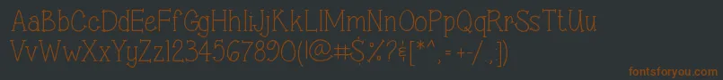 Шрифт SweetSassySerif – коричневые шрифты на чёрном фоне