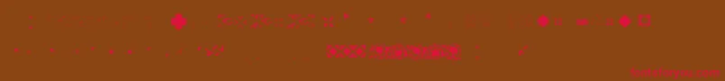 フォントPfornmtreasures2Layer4 – 赤い文字が茶色の背景にあります。