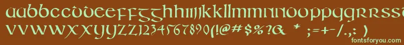 フォントIrishuncialphabet – 緑色の文字が茶色の背景にあります。