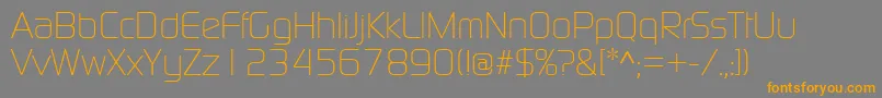 フォントContinuumLight – オレンジの文字は灰色の背景にあります。