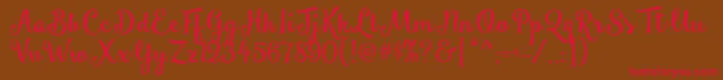 フォントSmoothieShoppe – 赤い文字が茶色の背景にあります。