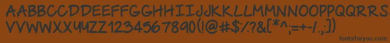 UrbanClass Font – Black Fonts on Brown Background