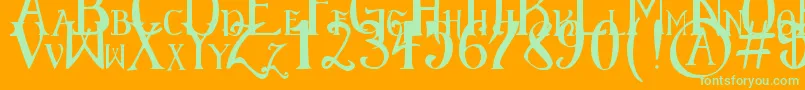 ElementaryGothicScaled-Schriftart – Grüne Schriften auf orangefarbenem Hintergrund