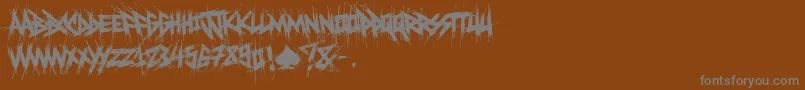 ElfontDestroy-Schriftart – Graue Schriften auf braunem Hintergrund