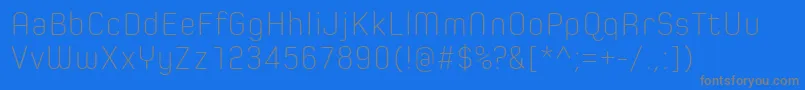 SpoonExtraLight-fontti – harmaat kirjasimet sinisellä taustalla