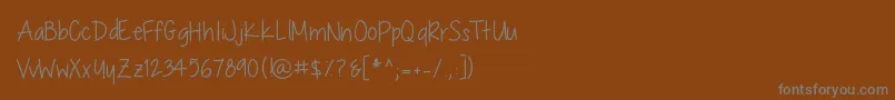 Шрифт ChocolateCoveredRaindrops – серые шрифты на коричневом фоне