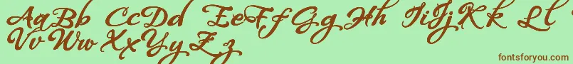 Fonte WhispersCalligraphyDemoSinuousBold – fontes marrons em um fundo verde