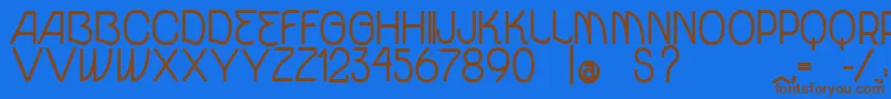 フォントVtksUnidadeBold – 茶色の文字が青い背景にあります。