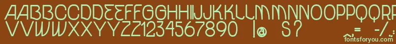 フォントVtksUnidadeBold – 緑色の文字が茶色の背景にあります。