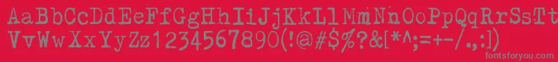 Kirjainkone Font – Gray Fonts on Red Background