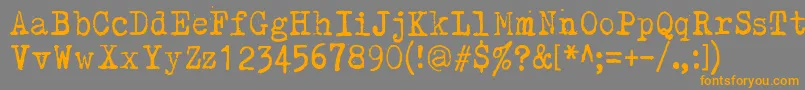 Kirjainkone Font – Orange Fonts on Gray Background