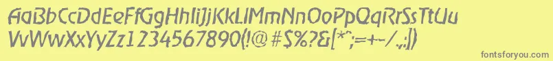 OnstagerandomItalic-fontti – harmaat kirjasimet keltaisella taustalla