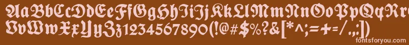 PlakatFrakturunz1l-fontti – vaaleanpunaiset fontit ruskealla taustalla