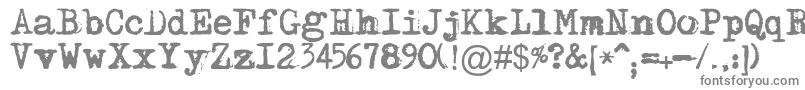 Maszynaplus-fontti – harmaat kirjasimet valkoisella taustalla