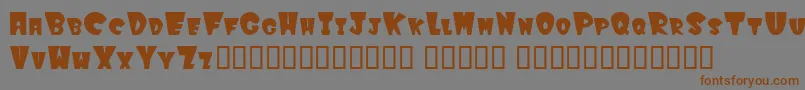 フォントWinkfilled – 茶色の文字が灰色の背景にあります。