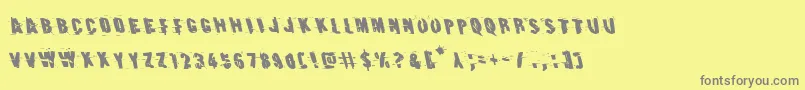 Earthshakeleft-fontti – harmaat kirjasimet keltaisella taustalla
