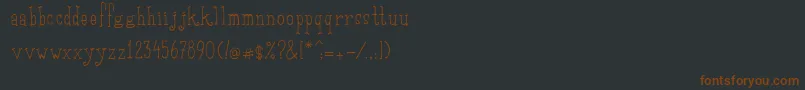 Fonte SaditekinscriptRegular – fontes marrons em um fundo preto