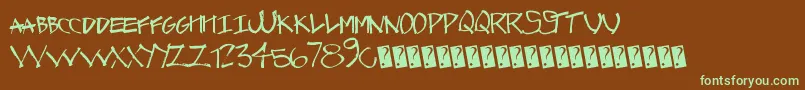 フォントGraffcaps – 緑色の文字が茶色の背景にあります。