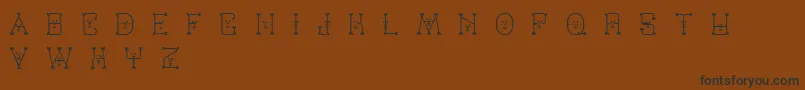 Varmint-Schriftart – Schwarze Schriften auf braunem Hintergrund