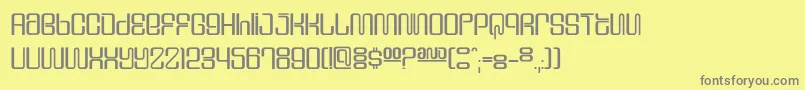 フォントDssupervix – 黄色の背景に灰色の文字