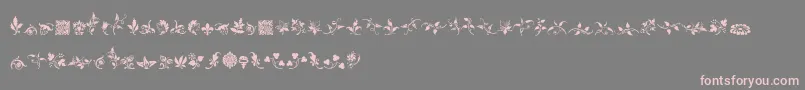 RoughFleuronsFree-Schriftart – Rosa Schriften auf grauem Hintergrund