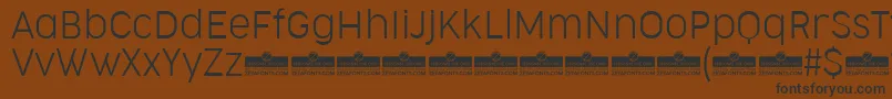 CocogooseNarrowUltralightTrial Font – Black Fonts on Brown Background
