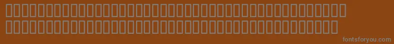 McsAbhaSpoted Font – Gray Fonts on Brown Background