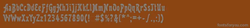 フォントKarollatt – 茶色の背景に灰色の文字