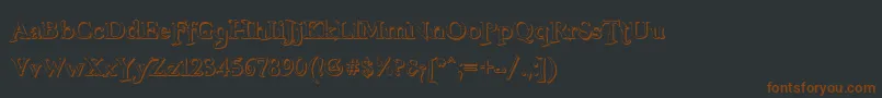 Fonte FreebooterShadow – fontes marrons em um fundo preto