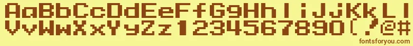 フォントMmrock9 – 茶色の文字が黄色の背景にあります。