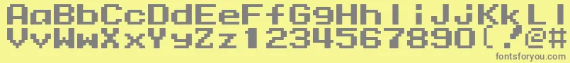 フォントMmrock9 – 黄色の背景に灰色の文字