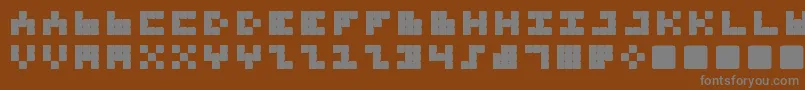 フォントTrioNonaTone – 茶色の背景に灰色の文字