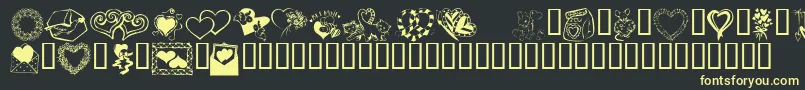 フォントKrKatsGotANewValentine – 黒い背景に黄色の文字