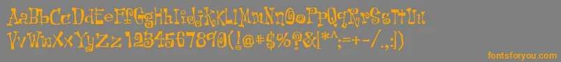 フォントKotLeopold – オレンジの文字は灰色の背景にあります。