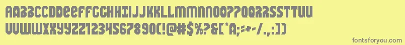 Warnation-fontti – harmaat kirjasimet keltaisella taustalla