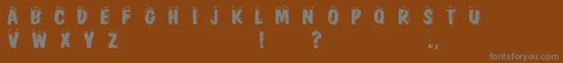 Cracklingfire-Schriftart – Graue Schriften auf braunem Hintergrund